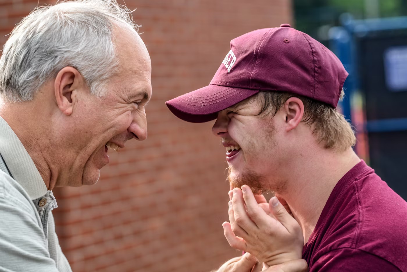 Caregiver and client sharing a joyful moment
